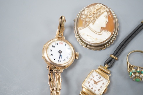 A lady's early 20th century 9ct gold manual wind wrist watch, on a 9ct strap, gross 16.4 grams, a lady's 18k watch, gross 9.9 grams, a cameo brooch and a 9ct dress ring.